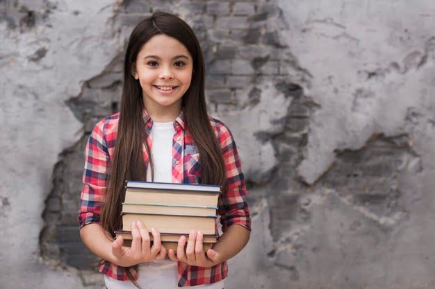 close-up-positive-young-girl-holding-pile-books_23-2148464493 close-up-positive-young-girl-holding-pile-books_23-2148464493